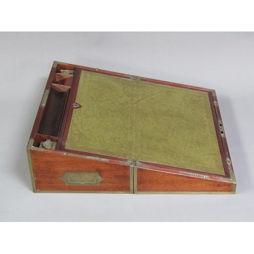 40 - An early 19c mahogany writing box, brass rail inlaid with brass edges and cut motif to the cover, gr... 