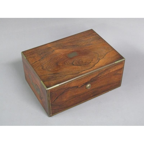 41 - A George IV figured walnut travelling box with brass rail inlay and edging, the box with original ve... 