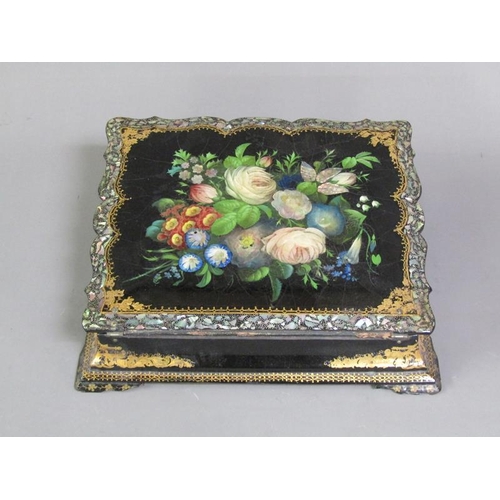 43 - A Victorian papier mache writing box, black lacquered and with a floral painted and mother of pearl ... 