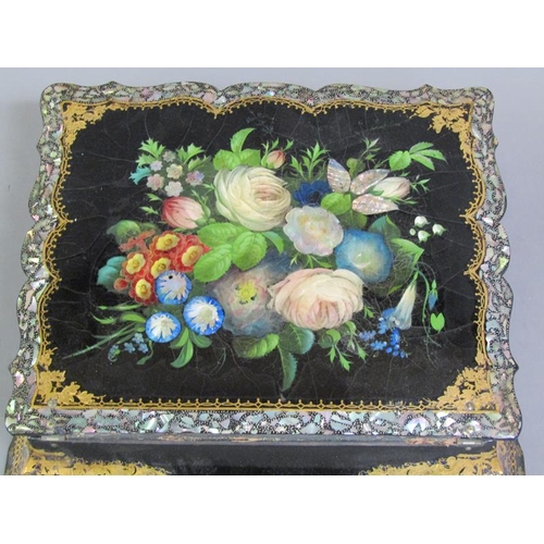 43 - A Victorian papier mache writing box, black lacquered and with a floral painted and mother of pearl ... 