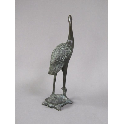 75 - An Oriental bronze figure of a crane standing on a turtle, 19.5cm h.