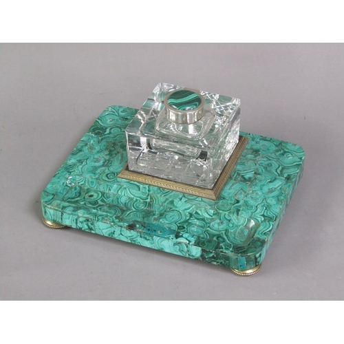 79 - A 19c malachite ink stand supporting a cut glass well with a hinged malachite mounted cover within a... 