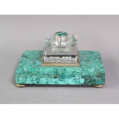 79 - A 19c malachite ink stand supporting a cut glass well with a hinged malachite mounted cover within a... 