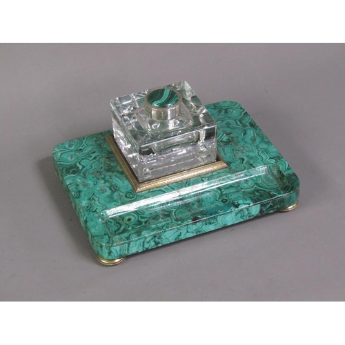 79 - A 19c malachite ink stand supporting a cut glass well with a hinged malachite mounted cover within a... 