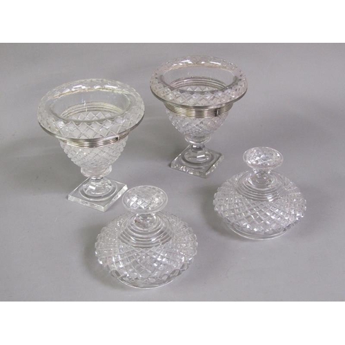 80 - A pair of early 19c cut glass bonbonnieres with lift off covers, having cut finials, the bowls with ... 