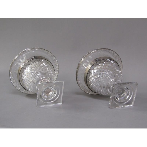 80 - A pair of early 19c cut glass bonbonnieres with lift off covers, having cut finials, the bowls with ... 