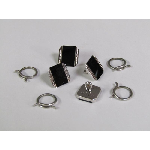 148 - A boxed set of 9ct white gold and black onyx cufflinks and studs.