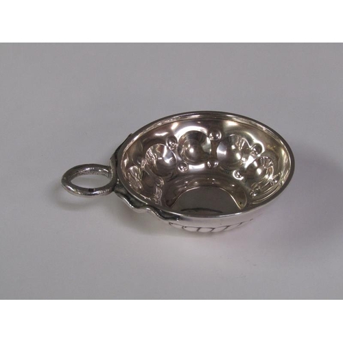 151 - A late 19c/early 20c French silver wine taster with a serpent handle, 9cm w overall.