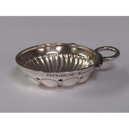 151 - A late 19c/early 20c French silver wine taster with a serpent handle, 9cm w overall.