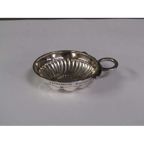 151 - A late 19c/early 20c French silver wine taster with a serpent handle, 9cm w overall.