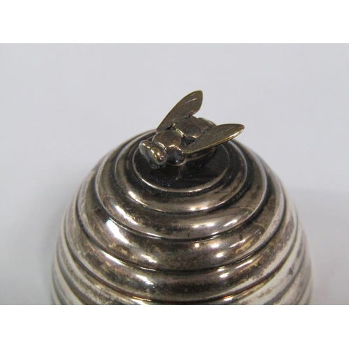 155 - A silver beehive ring box with a bee finial, supported on three ball feet, London 1970/80, 5cm h.