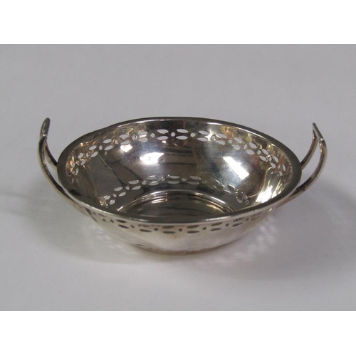 158 - A pair of pierced two handled silver bonbon dishes, Birmingham 1914, 2.4oz t, 9cm diam.