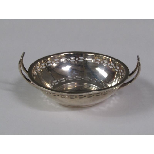 158 - A pair of pierced two handled silver bonbon dishes, Birmingham 1914, 2.4oz t, 9cm diam.