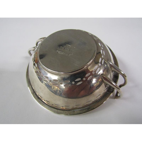 158 - A pair of pierced two handled silver bonbon dishes, Birmingham 1914, 2.4oz t, 9cm diam.