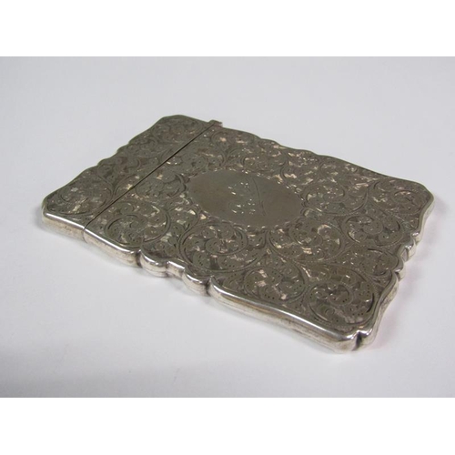 164 - A late Victorian visiting card case with shaped edge, chased all over with scroll and leaf designs, ... 