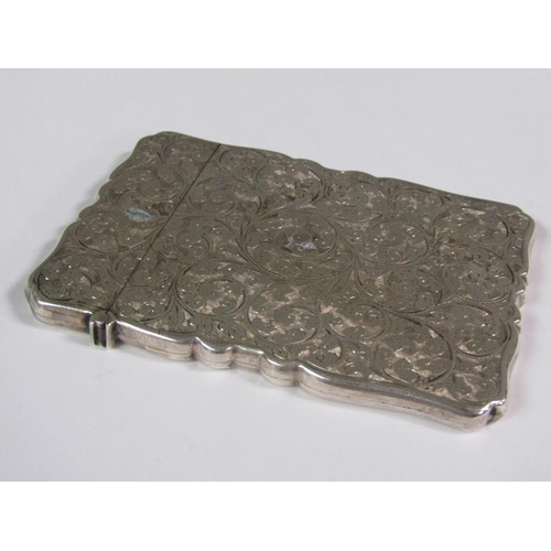 164 - A late Victorian visiting card case with shaped edge, chased all over with scroll and leaf designs, ... 