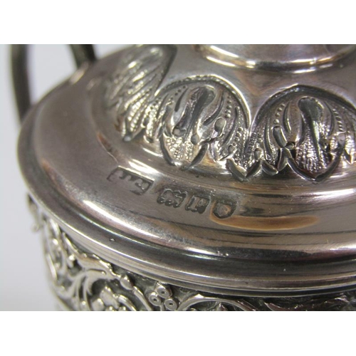 168 - A two handled silver trophy, embossed and chased, London 1910, 6oz t, 14cm h.