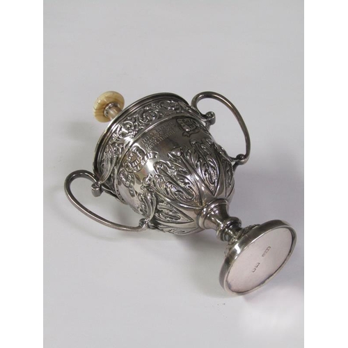 168 - A two handled silver trophy, embossed and chased, London 1910, 6oz t, 14cm h.