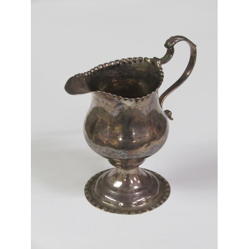 176 - A George III silver cream jug of baluster form with shaped rims, London 1772, 2.8oz t, 10cm h.