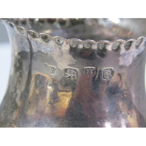 176 - A George III silver cream jug of baluster form with shaped rims, London 1772, 2.8oz t, 10cm h.