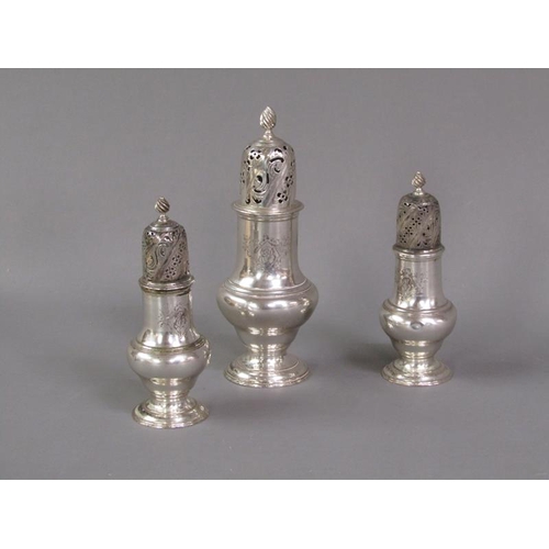 181 - Three George III sugar casters, all of baluster form with pierced dome covers and flame finials, Lon... 