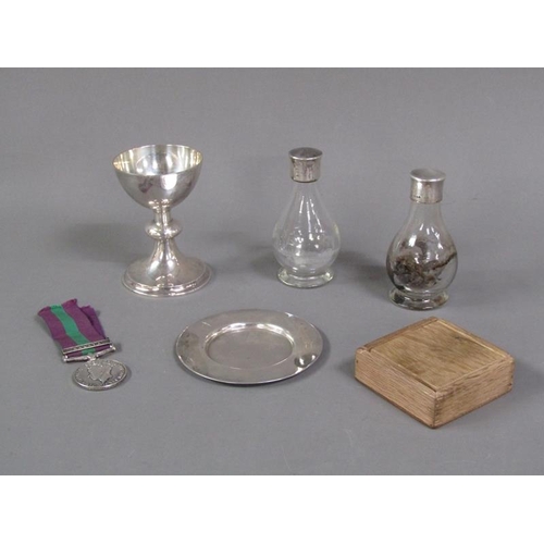 200 - A Holy communion set with matched silver and silver mounted bottles, c.1930/40, in black leather car... 