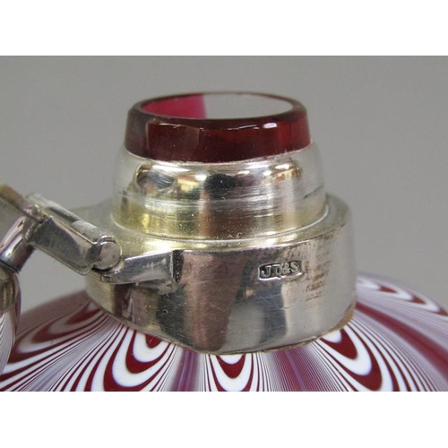 208 - An early 20c Nailsea glass pocket flask with a silver plated hinged domed cover and pull off base to... 