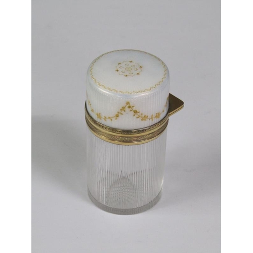 59 - An early 20c French cosmetic salts bottle and stopper with a vertically ribbed cylindrical body with... 