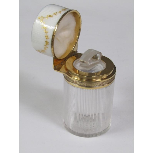 59 - An early 20c French cosmetic salts bottle and stopper with a vertically ribbed cylindrical body with... 