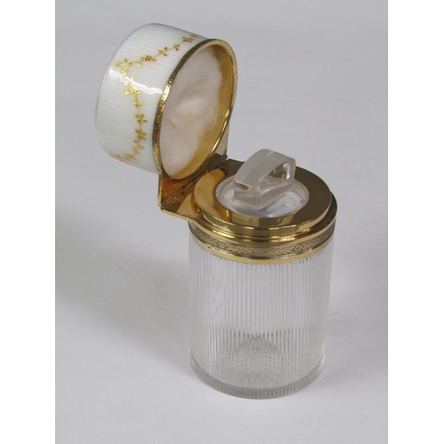 59 - An early 20c French cosmetic salts bottle and stopper with a vertically ribbed cylindrical body with... 