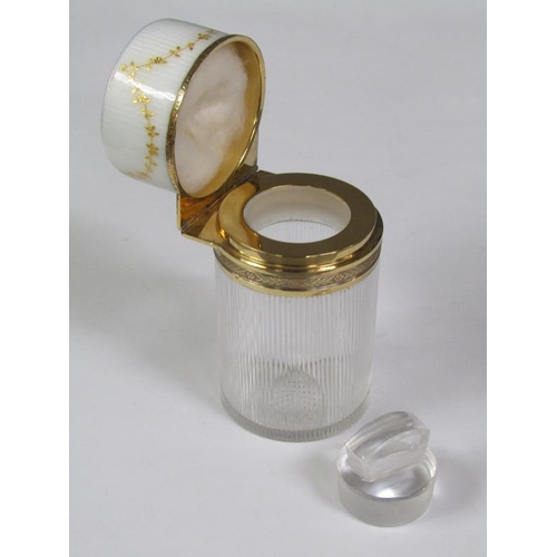 59 - An early 20c French cosmetic salts bottle and stopper with a vertically ribbed cylindrical body with... 