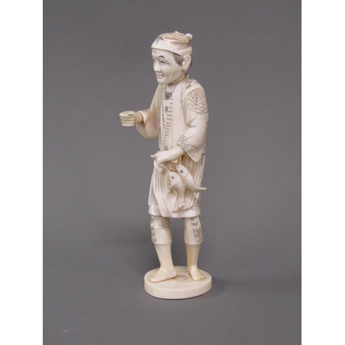 83 - A Japanese Meiji period carved ivory figure of a gentleman carrying two fish, base with incised sign... 