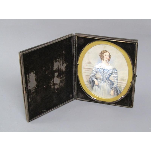 87 - Unsigned - An early 19c portrait of a lady, oval framed and glazed, in a velvet lined folding box, 1... 