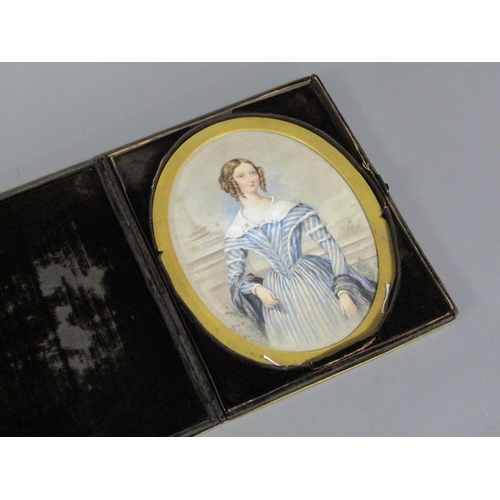 87 - Unsigned - An early 19c portrait of a lady, oval framed and glazed, in a velvet lined folding box, 1... 