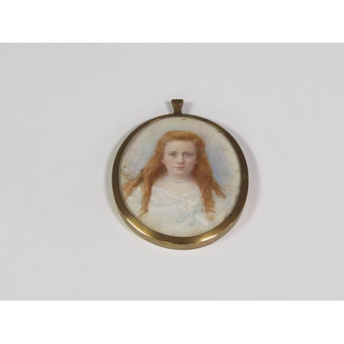 89 - A 19c oval portrait miniature of a young lady with red hair and wearing a string of pearls, oval fra... 