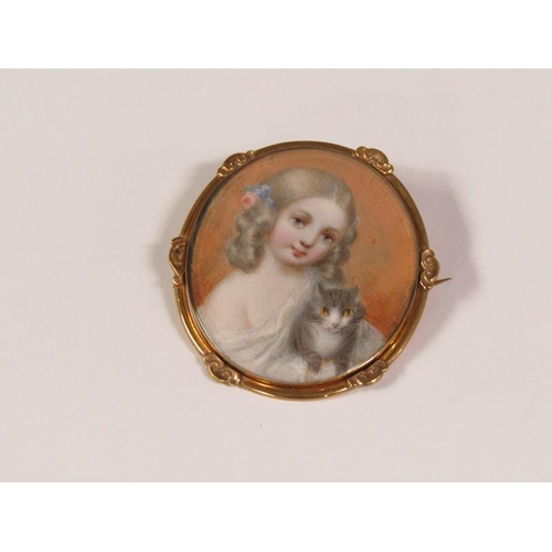 91 - A 19c framed oval portrait miniature of a young lady with her cat, in gilt frame, 5.5cm x 4.5cm.