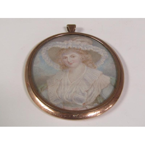 94 - A 9ct gold framed oval portrait miniature of a lady with red hair wearing a wide brimmed feathered h... 