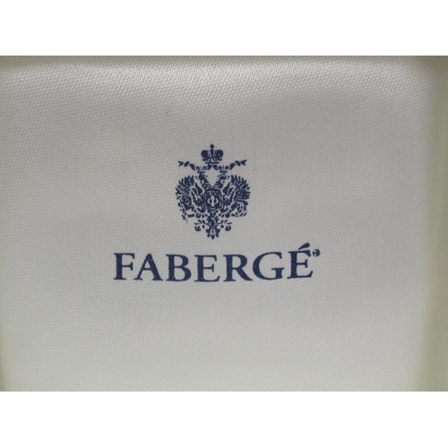 104 - A pair of Faberge 18ct gold enamel and diamond solitaire set cufflinks, 15.3g, in Faberge wooden box... 