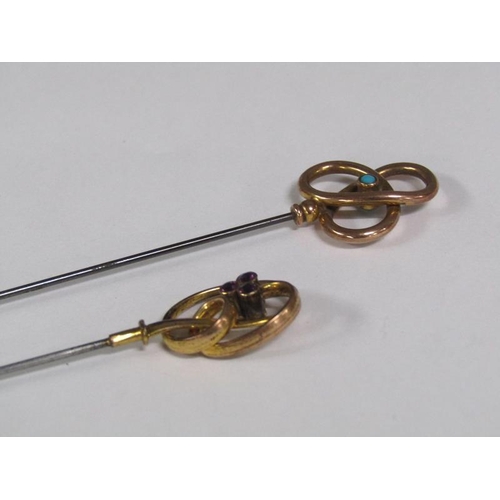 113 - Two late 19c/early 20c hat pins with gold swirling terminals, one set with a turquoise, the other se... 