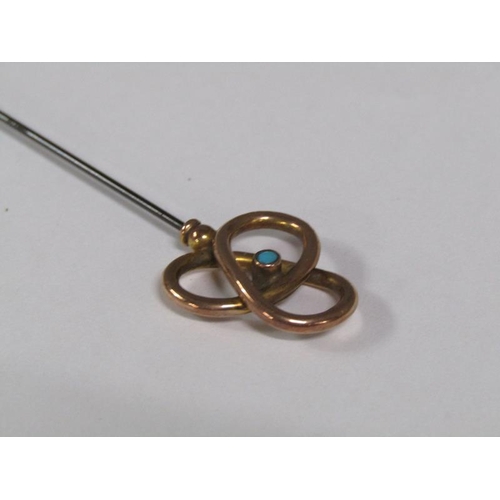 113 - Two late 19c/early 20c hat pins with gold swirling terminals, one set with a turquoise, the other se... 