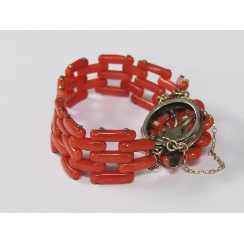 117 - An Edwardian coral bracelet, the bracelet of linked gate design with a bud beaded clasp mount.