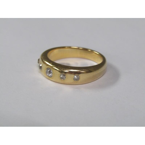 118 - An 18ct gold ring set with five cut diamonds, 9.5g.