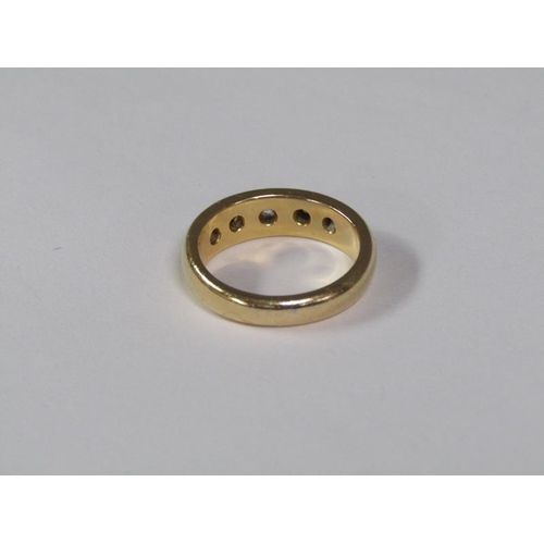 118 - An 18ct gold ring set with five cut diamonds, 9.5g.