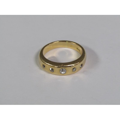 118 - An 18ct gold ring set with five cut diamonds, 9.5g.