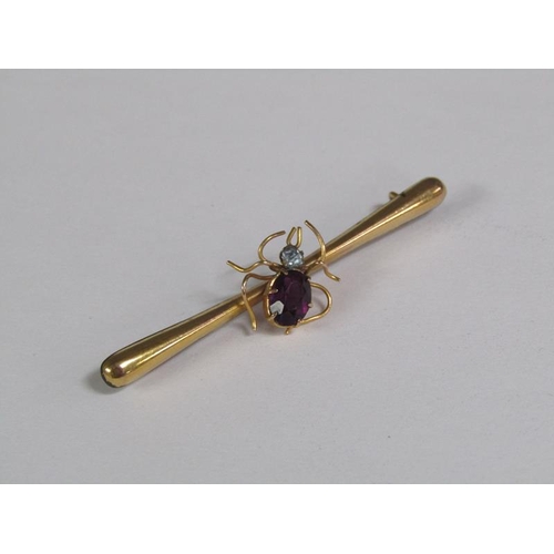 122 - An Edwardian 9ct gold spider bar brooch, the insect set with a cut amethyst and with a aquamarine he... 