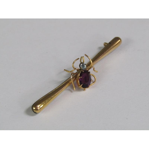 122 - An Edwardian 9ct gold spider bar brooch, the insect set with a cut amethyst and with a aquamarine he... 