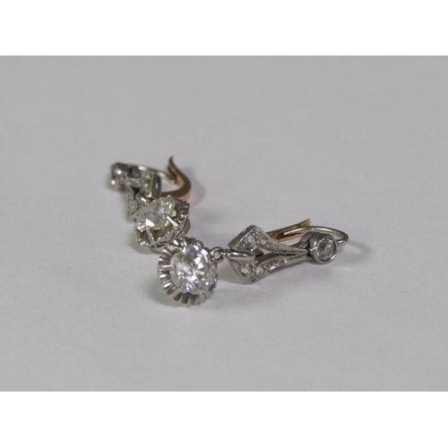 125 - A pair of gold platinum diamond earrings with solitaire drops, each approx. 0.5ct.