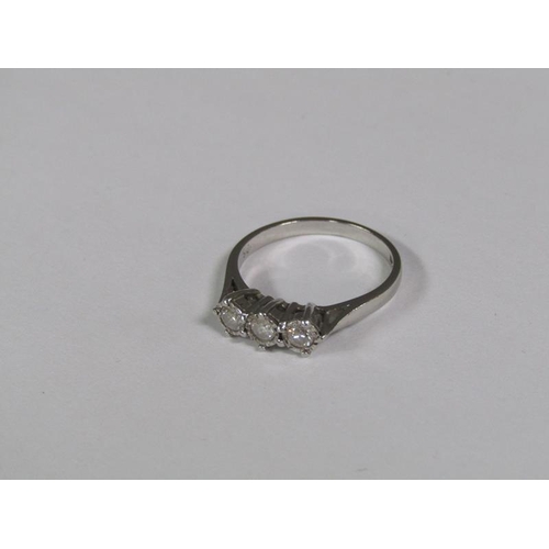 130 - An 18ct white gold three stone diamond set ring.