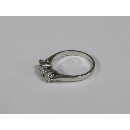 130 - An 18ct white gold three stone diamond set ring.