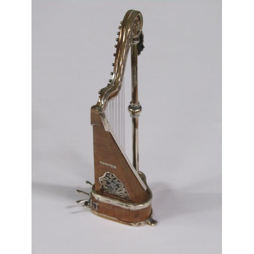 58 - An early 20c miniature model of a harp constructed of wood and white metal, bearing a name plate 'Sa... 